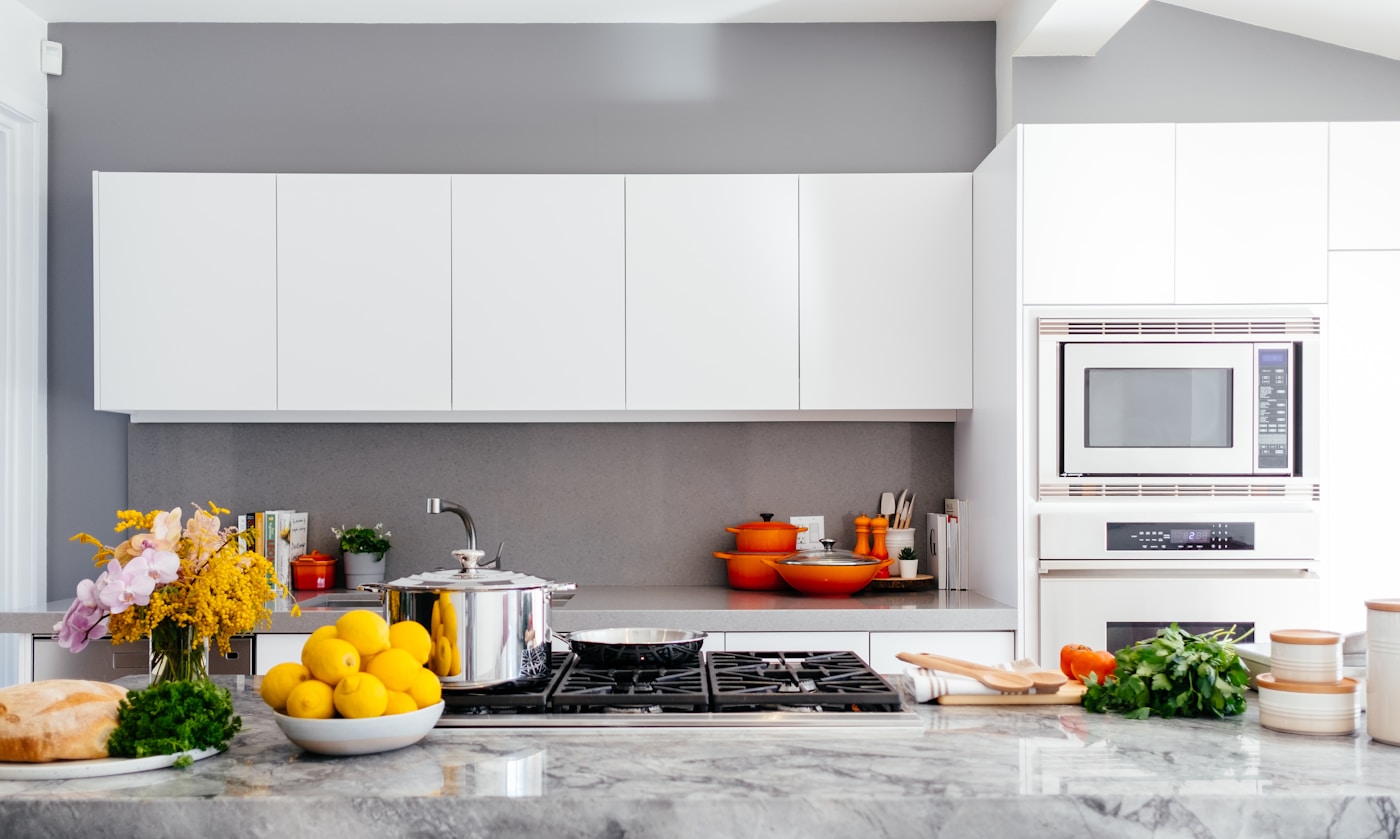 Professional kitchen equipped with cookware and foodservice essentials